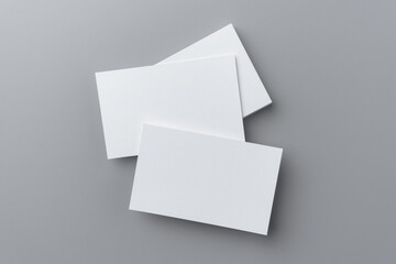 three business card isolated on grey background