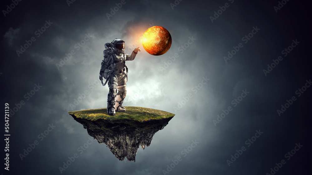 Wall mural astronaut walking on an unexplored planet . mixed media