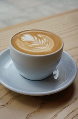 cup of coffee on wooden table