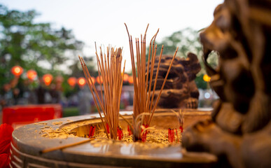 Burning incense sticks at the big Chinese temple