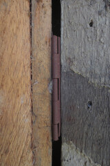 Rusty wooden door hinges. Photo portrait  