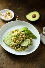 Couscous with pesto, cucumber and avocado