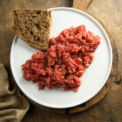 Homemade steak tartare with rye bread