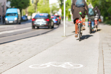 Fototapeta premium Bicycle sign on bike path in Europe. Bicyclist in bike lane on Street
