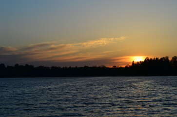 Sunset on the background of a lake in the town of Gizycko in Poland