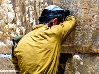 An Israeli soldier prays at the Western Wall