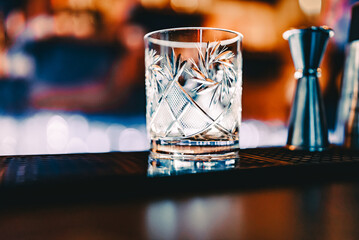 empty glass on a bar counter in bar or pub