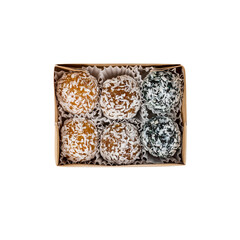 Healthy homemade sweet energy balls of dried fruits and nuts in coconut. The composition of dried apricots, raisins, figs, dates, almonds, walnuts, hazelnuts, honey. For healthy lifestyle