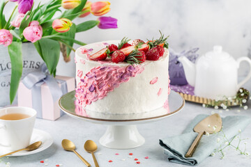 festive white and pink cake on a light background. Sweets concept