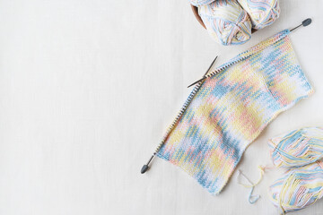 Craft knitting homemade creative work with knitted texture , needles