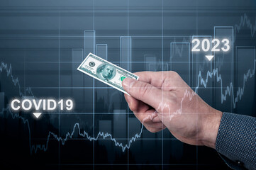 inflation. man holds small one hundred dollar bill in his hand, symbol of inflation. concept of...