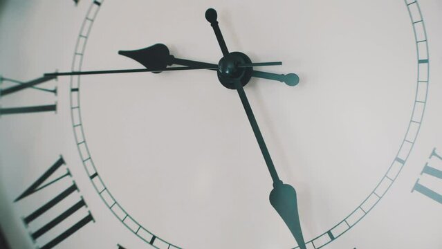 4k time lapse of a wall clock moving quickly in time. Wall Clock with roman numbers