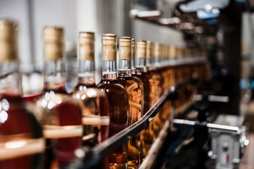 Industrial wine bottling plant theme. Modern industry production line for alcohol drink bottling...
