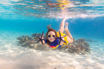 Child snorkeling. Kids underwater. Beach and sea.