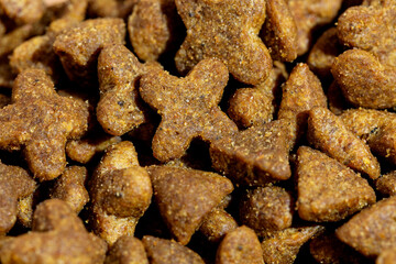 Dog or cat food or kibble shot up close. Top view background