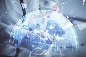 Multi exposure of woman hands typing on computer and business theme hologram drawing. Success...