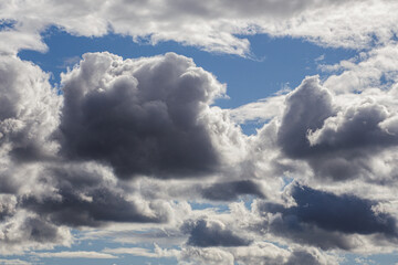 Dramatic storm clouds for the background. Isolated summer storm clouds before a thunderstorm. Dark storm clouds before the rain. Bad weather.  A heavenly landscape of clouds in the sky on a rainy day.