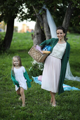 Fototapeta premium mother with daughter at a picnic