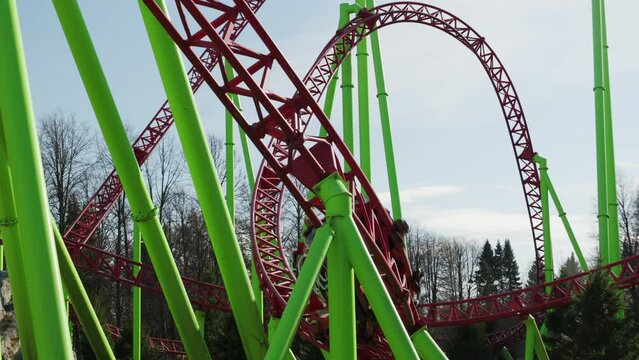 roller coaster in the park, people relax and have fun on the weekend