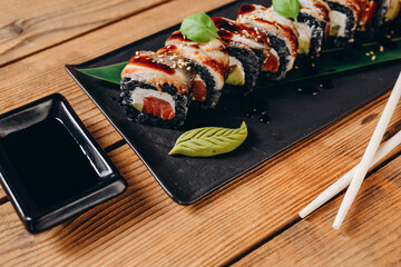 There are a lot of fresh sushi which are served to the customers.