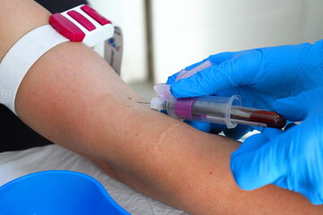 A female patient having blood drawn for testing