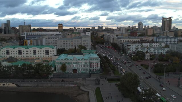 Embankment of the central pond and Plotinka, the historic center of the Yekaterinburg city, Russia. Stock footage. Aerial view of a summer city streets and buildings.