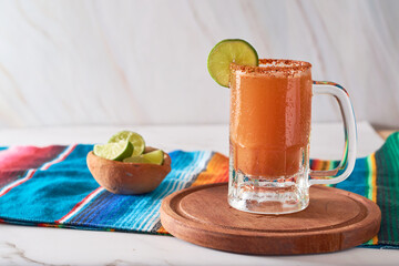Mexican cocktail, michelada, made with beer and tomato juice.