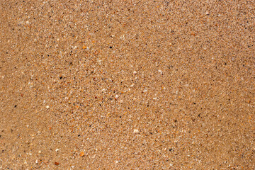 Beach sand texture on a summer day. Top view, flat lay