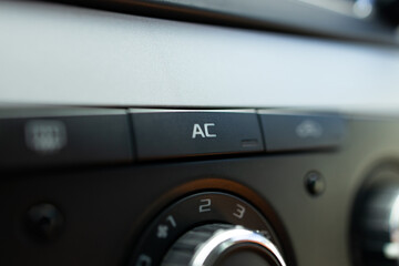 Fototapeta premium Car ac air turn on off button close up. auto air conditioning repair service concept
