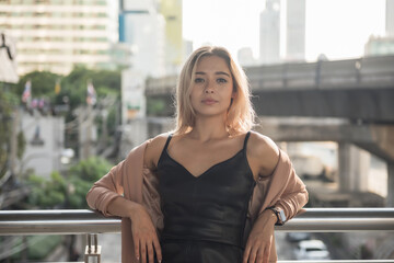 young American attractive model in city at sunset