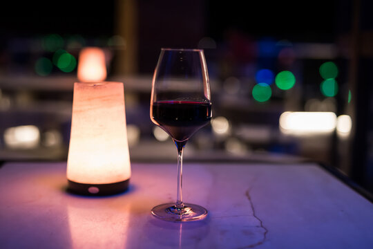 Glass Of Red Wine At Outdoor Rooftop Bar