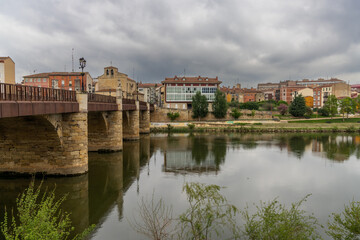 view of the stone bridge across the Ebro River and the historic city center of Miranda de Ebro