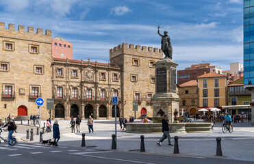 Obraz premium view of the lively and busy Plazuela de Marquez square with many people enjoying a sunny weekend day