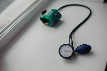 Tonometer on a white background. Diagnostic device for determining blood pressure and pulse rate