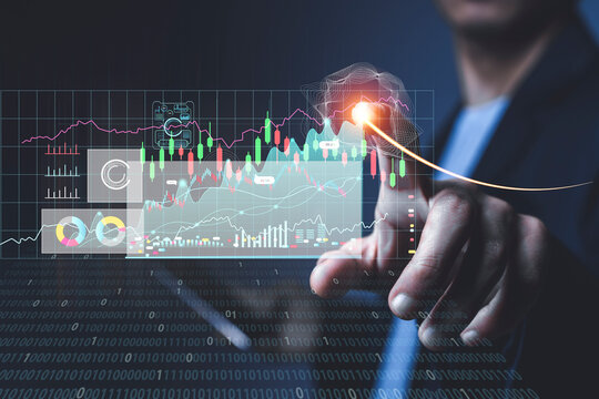 Businessman or trader is showing a growing virtual hologram stock, invest