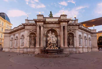 Obraz premium Neptune fountain on Albertinaplatz square at sunrise, Vienna, Austria