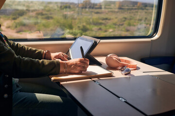 Close-up of a woman working from a train