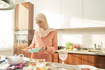 Muslim woman preparing food for lunch at home