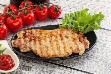 Grilled pork steak with ketchup