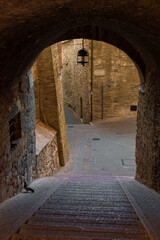 Ancient street in Assisi historic center, Umbria Italy
