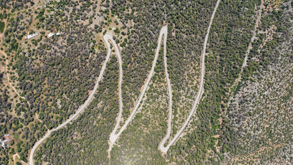 Aerial drone top down serpentine mountain scenic zig zag road with 