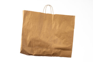 Paper bag on white. Simple paper shopping bag. Recycled shopping bag concept. Place for inscription...