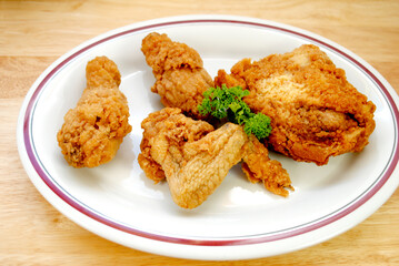 Fried Chicken Pieces Served on a White Plate	