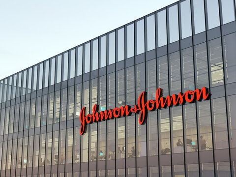 New Brunswick, NJ, USA. May 2, 2022. Editorial Use Only, 3D CGI. Johnson & Johnson Signage Logo on Top of Glass Building. Workplace of Pharmaceutical Industry Company Office Headquarters.