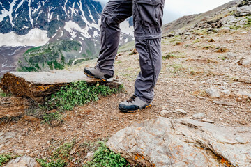 Male legs in comfortable hiking boots. Travel concept.