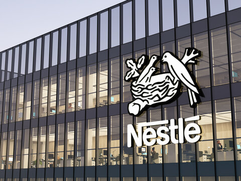 Vevey, Switzerland. May 2, 2022. Editorial Use Only, 3D CGI. Nestle Signage Logo on Top of Glass Building. Workplace Food Company Office Headquarters.
