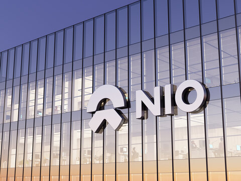 Shanghai, China. May 2, 2022. Editorial Use Only, 3D CGI. NIO Company Signage Logo on Top of Glass Building. Workplace Electric Vehicles Automaker Office Headquarters.
