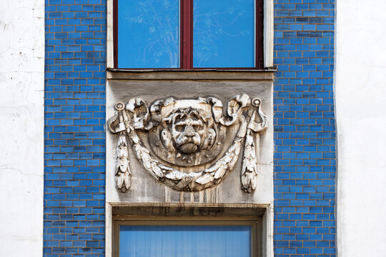 Fragment of decor building, mascaron lion on the facade of the building