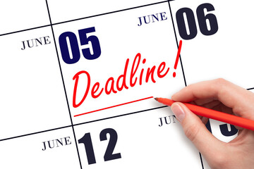 Hand drawing red line and writing the text Deadline on calendar date June 5. Deadline word written...