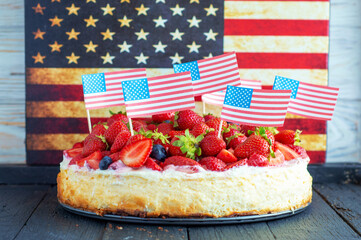 traditional strawberry cheesecake and american patriotic breakfast table, usa flag	
